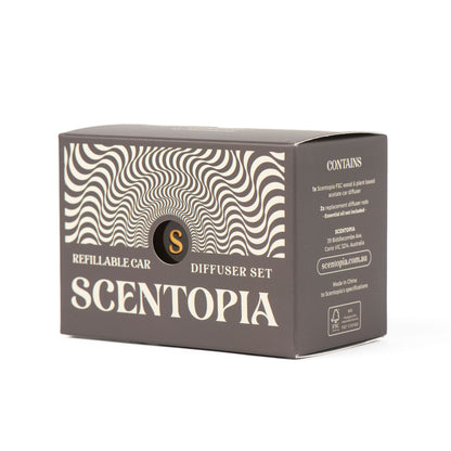 A box for a Scentopia refillable car diffuser set, featuring a dark brown and beige design with wavy optical illusion patterns and the Scentopia brand name.