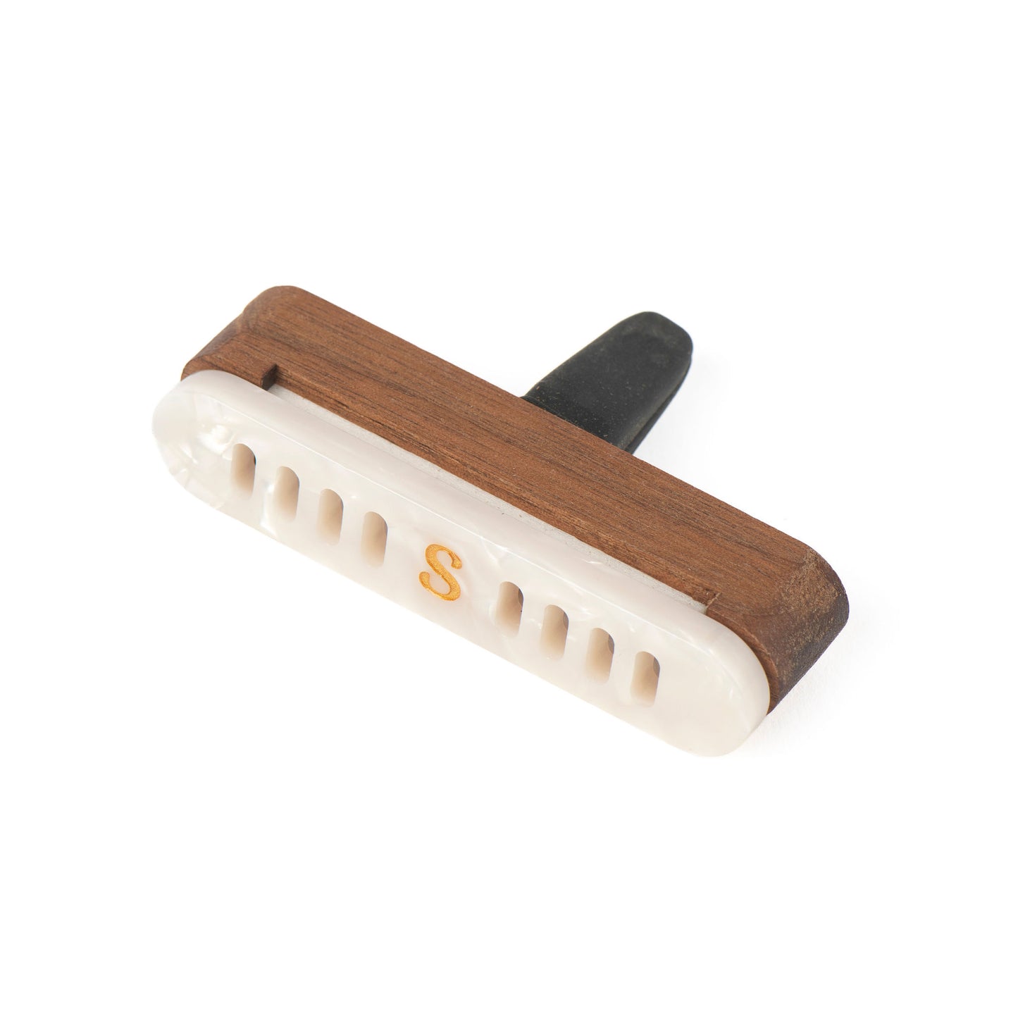 A car diffuser with walnut wood-grain case, an pearl front section with ventilation slots and a small gold letter 'S', and a black silicon clip, shown on a white background.
