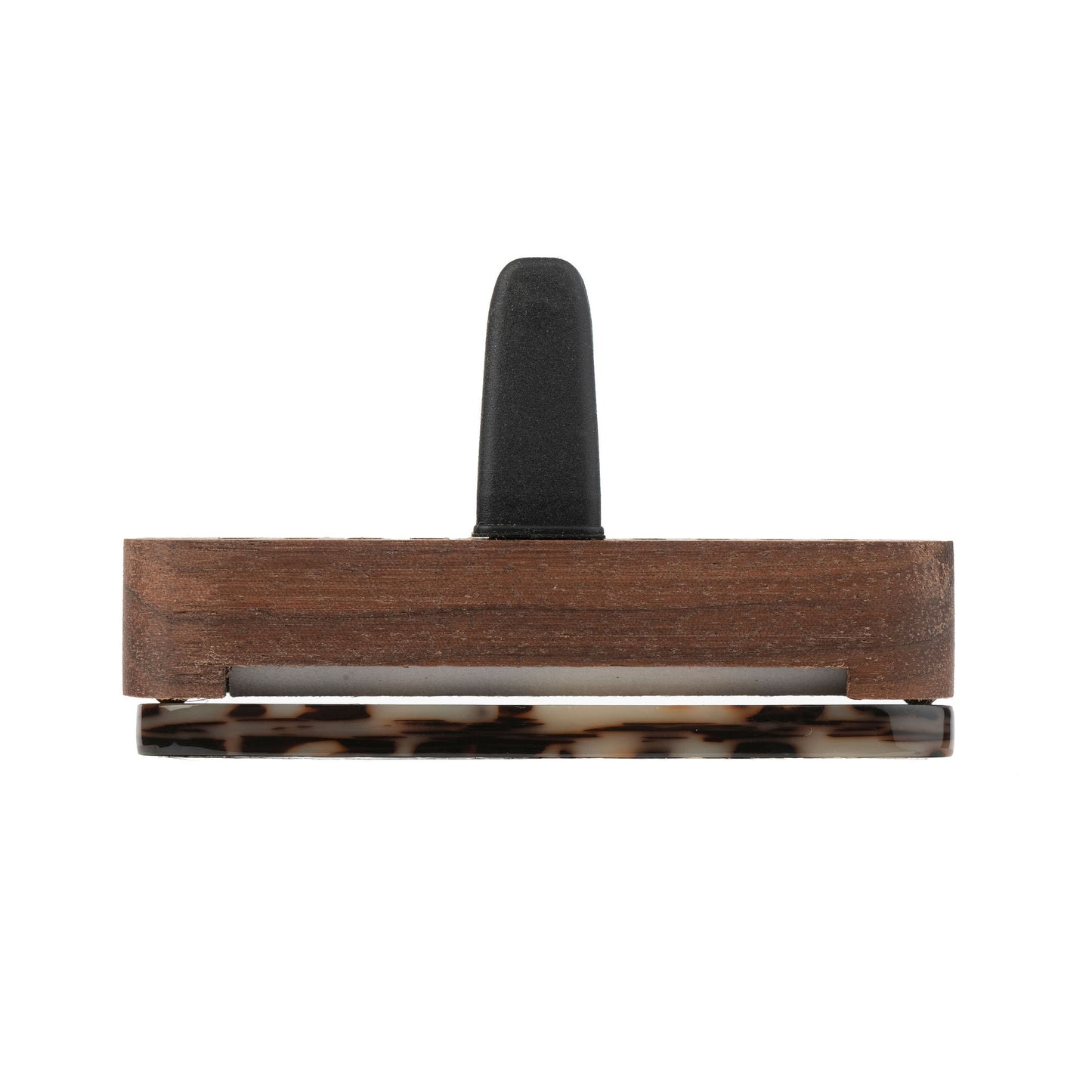 Top view of a Scentopia car diffuser in tortoiseshell acetate in brown, black, and beige, featuring a gold-colored 'S' monogram n the front. With a wooden case, set against a plain white background.